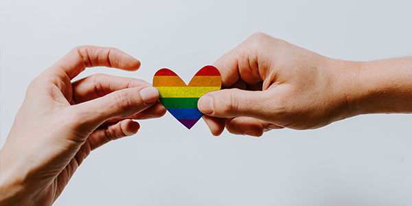 rainbow heart being held